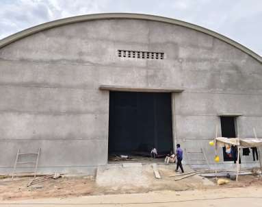 Row of arched sheds under construction